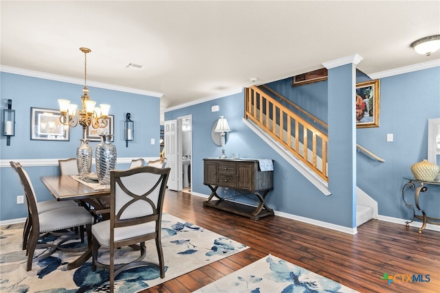 dining room with visible vents, stairway, wood finished floors, and ornamental molding