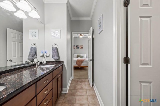 408 O W Lowrey, Salado, TX 76571 - ensuite bathroom with crown molding, double vanity, tile patterned floors, a ceiling fan, and baseboards