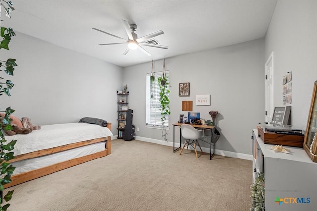 408 O W Lowrey, Salado, TX 76571 - bedroom with light carpet, baseboards, a desk, and a ceiling fan