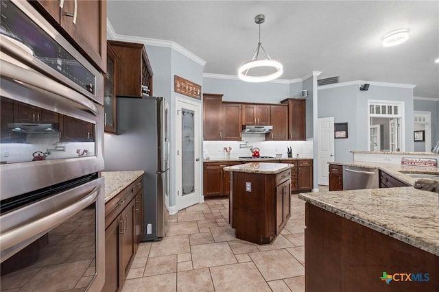 408 O W Lowrey, Salado, TX 76571 - kitchen featuring stainless steel appliances, ornamental molding, under cabinet range hood, a sink, and light stone countertops