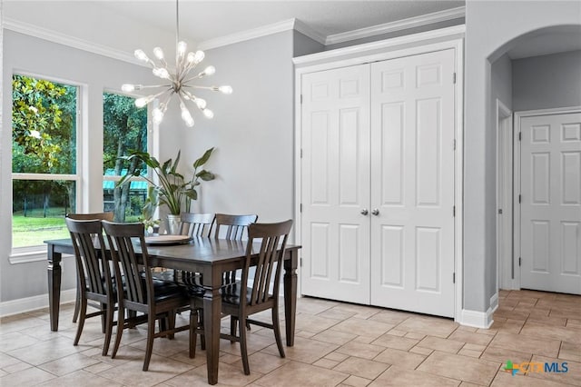 408 O W Lowrey, Salado, TX 76571 - dining space with arched walkways, baseboards, plenty of natural light, a chandelier, and crown molding