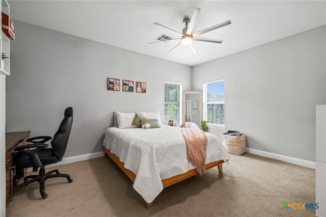 408 O W Lowrey, Salado, TX 76571 - bedroom with light colored carpet, a desk, ceiling fan, and baseboards