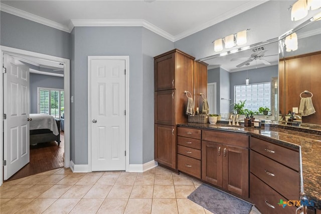 408 O W Lowrey, Salado, TX 76571 - bathroom with ceiling fan, tile patterned flooring, ornamental molding, vanity, and connected bathroom