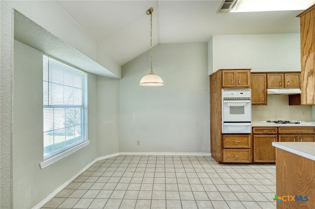 kitchen with pendant lighting, white appliances, and lofted ceiling