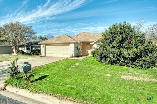 ranch-style house featuring a garage and a front lawn