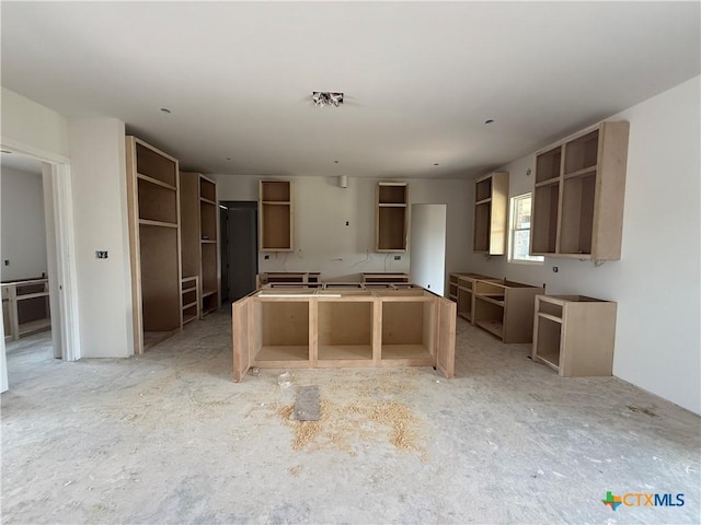 1242 Ambrose Dr, Salado, TX 76503 - kitchen with open shelves and a center island
