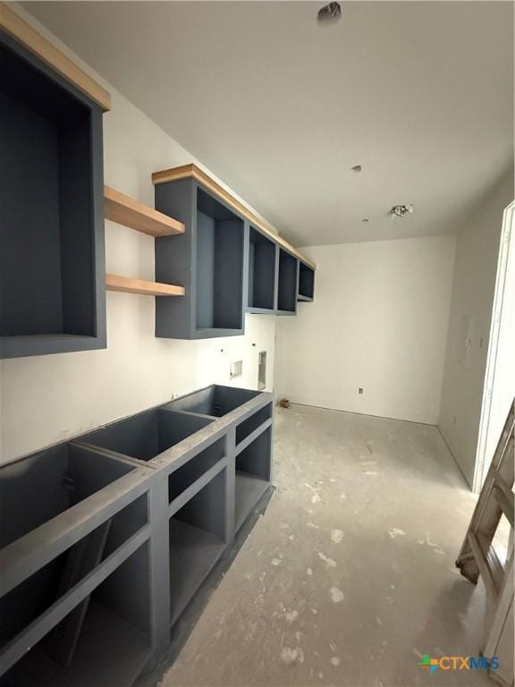 1242 Ambrose Dr, Salado, TX 76503 - interior space featuring concrete flooring and open shelves