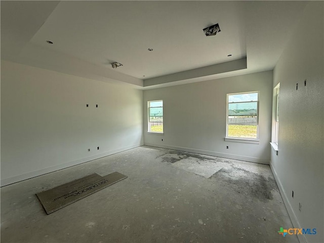 1242 Ambrose Dr, Salado, TX 76503 - spare room with a tray ceiling and baseboards