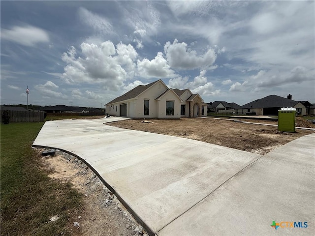 1242 Ambrose Dr, Salado, TX 76503 - ranch-style house featuring concrete driveway and a garage