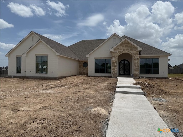 1242 Ambrose Dr, Salado, TX 76503 - view of front of home featuring a shingled roof and brick siding