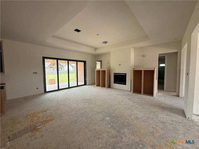 1242 Ambrose Dr, Salado, TX 76503 - unfurnished living room with a raised ceiling