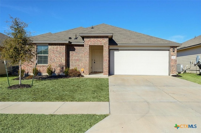 view of front of property with central AC, a front lawn, and a garage