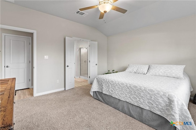 bedroom featuring ceiling fan, lofted ceiling, and light carpet