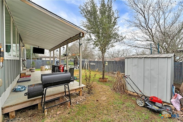 view of yard with a deck and a shed