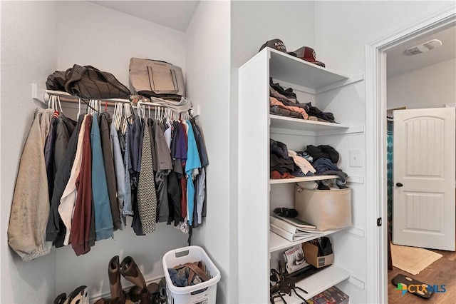 spacious closet featuring hardwood / wood-style floors