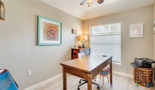 office with ceiling fan and light hardwood / wood-style flooring