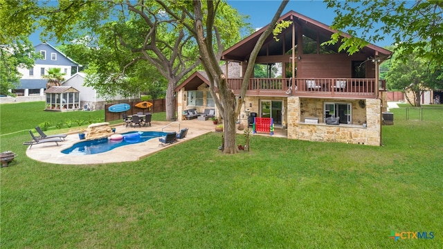 back of house featuring a patio, a yard, and a gazebo