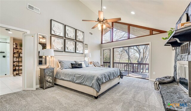 carpeted bedroom featuring access to exterior, high vaulted ceiling, and ceiling fan