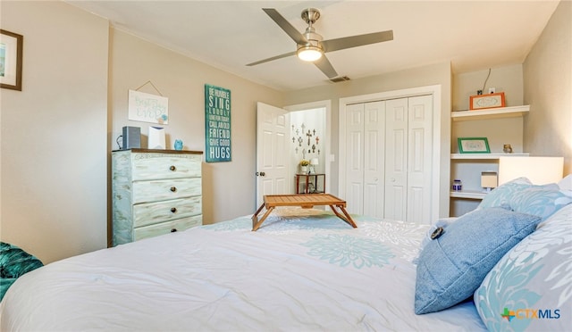 bedroom with ceiling fan and a closet