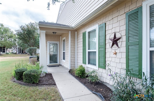 entrance to property with a yard