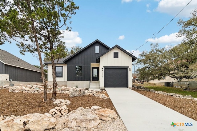 modern inspired farmhouse with a garage