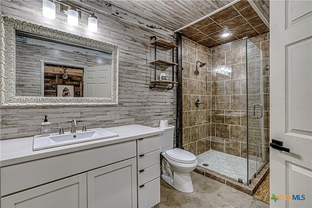 bathroom featuring vanity, toilet, and a shower with shower door