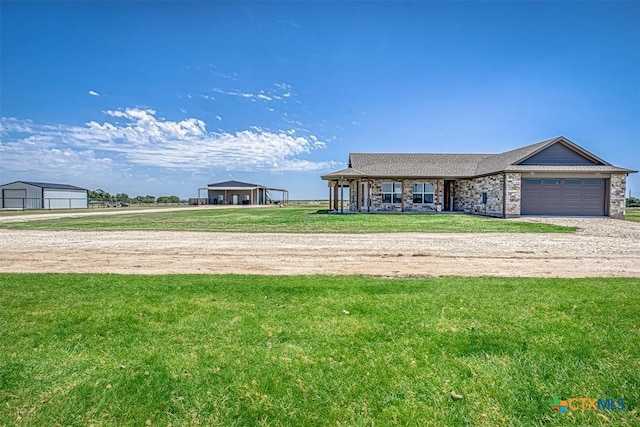 ranch-style house with a garage and a front yard