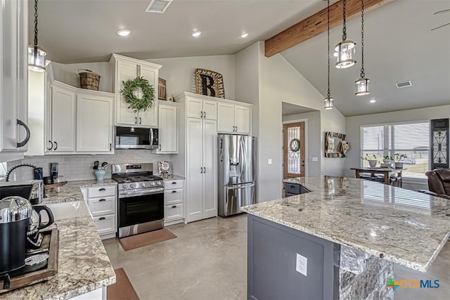 kitchen with a large island, pendant lighting, white cabinetry, and appliances with stainless steel finishes