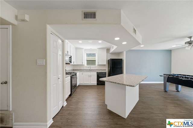 kitchen featuring white cabinetry, sink, black appliances, dark hardwood / wood-style floors, and a kitchen island