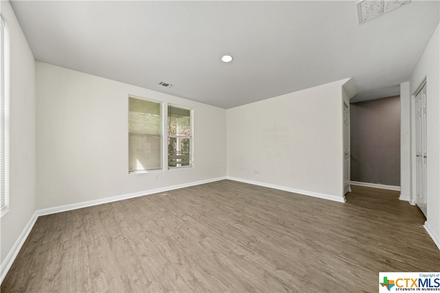 empty room with wood-type flooring