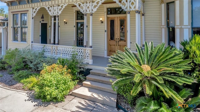 doorway to property with covered porch