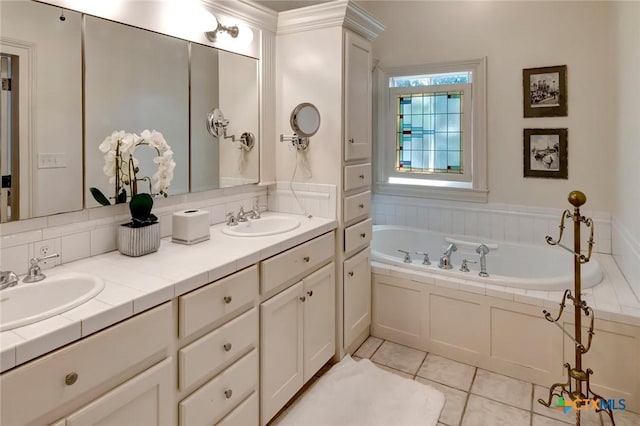 bathroom with vanity, tile patterned floors, and a bathtub