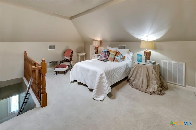 bedroom with carpet flooring and vaulted ceiling