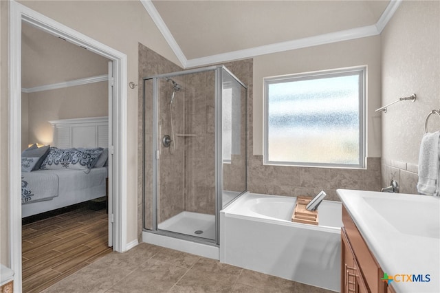 bathroom featuring ornamental molding, hardwood / wood-style floors, lofted ceiling, and vanity