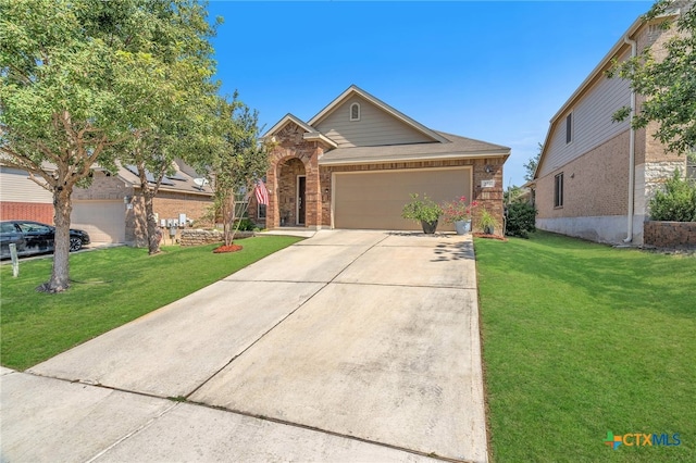 view of front of home featuring a garage and a front yard