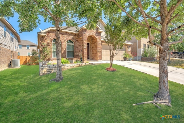 view of front of house with a front lawn and central air condition unit