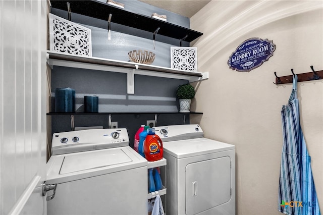 laundry area with separate washer and dryer