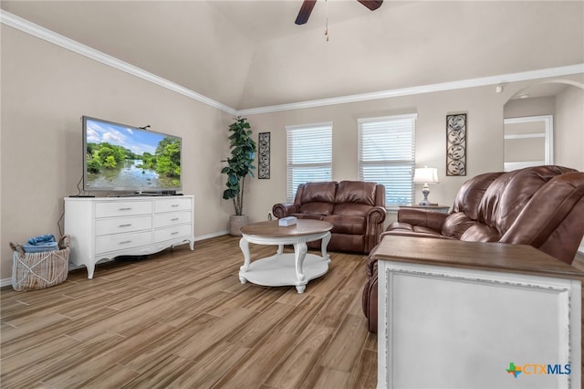 living room with ceiling fan, light wood-type flooring, lofted ceiling, and ornamental molding