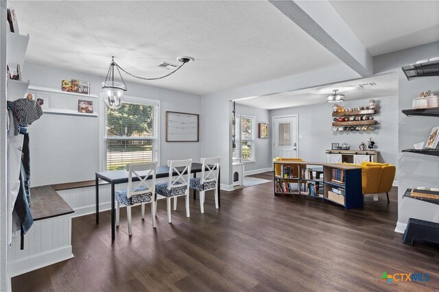 4007 Austin Ave, Waco, TX 76710 - dining area with a chandelier, plenty of natural light, wood finished floors, and a textured ceiling