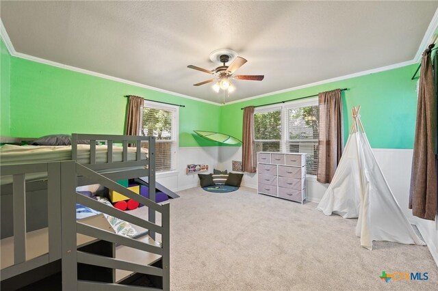 4007 Austin Ave, Waco, TX 76710 - carpeted bedroom featuring ornamental molding, ceiling fan, and a textured ceiling