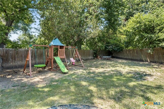 4007 Austin Ave, Waco, TX 76710 - fenced backyard featuring a playground