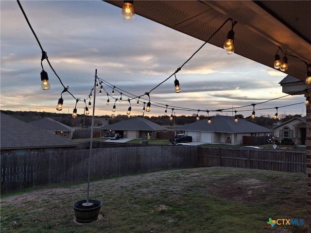 view of yard at dusk