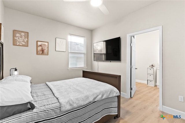 bedroom with ceiling fan and light wood-type flooring