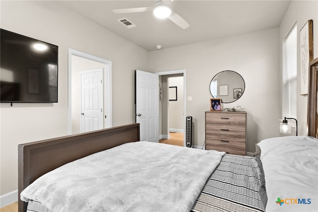 bedroom featuring ceiling fan and light hardwood / wood-style flooring