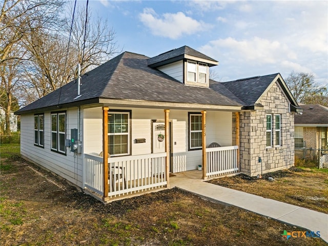 view of front of home featuring covered porch