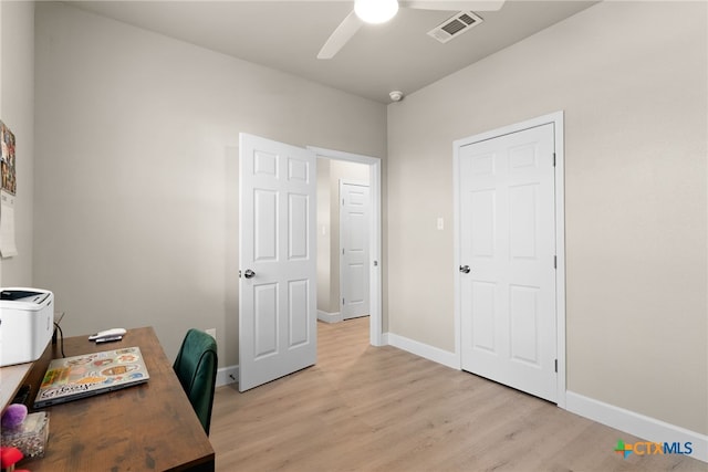 office area with ceiling fan and light hardwood / wood-style floors