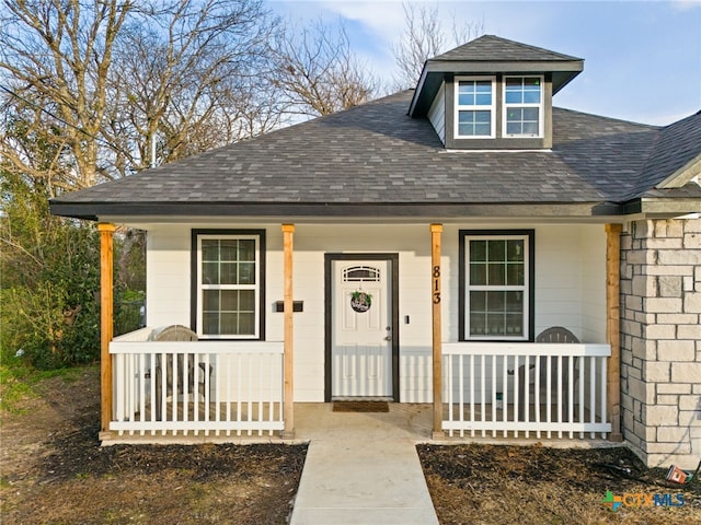 view of front of property featuring covered porch