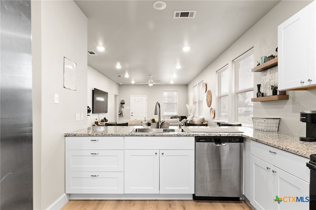 kitchen featuring dishwasher, white cabinets, sink, ceiling fan, and light hardwood / wood-style floors