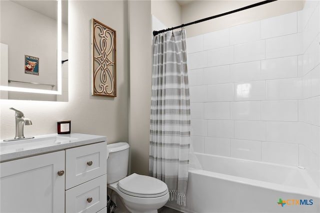 full bathroom featuring vanity, toilet, and shower / bath combo with shower curtain