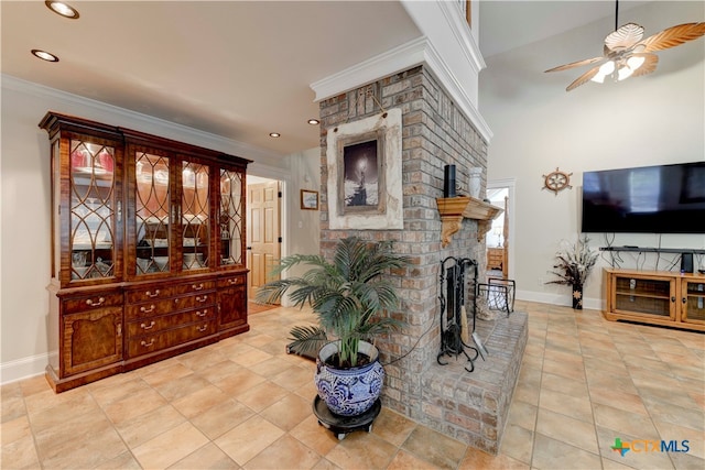 interior space featuring ceiling fan, ornamental molding, and a fireplace